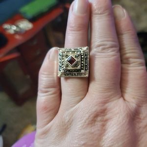 Women's 925 stamped marcasite and garnet ring.
